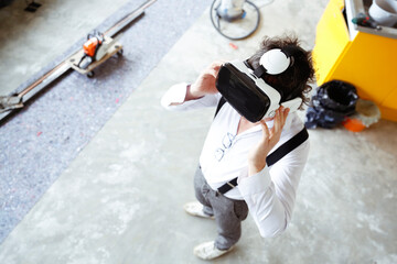 Architect using Virtual Reality Glasses at construction site