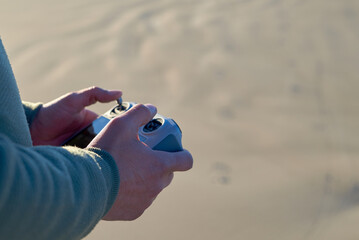 Man hands operating drone