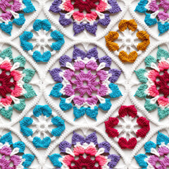 Fototapeta na wymiar Seamless rainbow crochet ornaments and floral decoration background