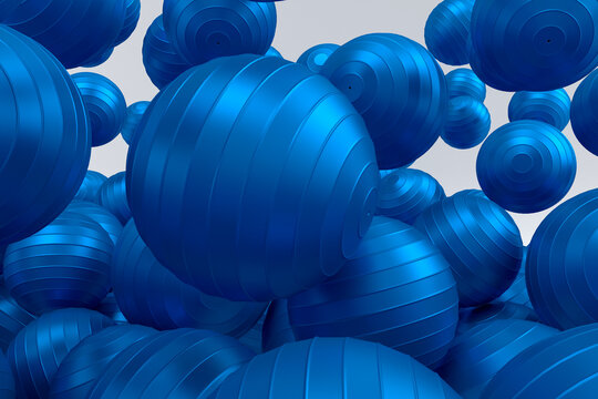 Many of flying blue fitness ball or fitball falling on white background