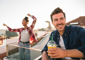 Happy young couple having a rooftop party