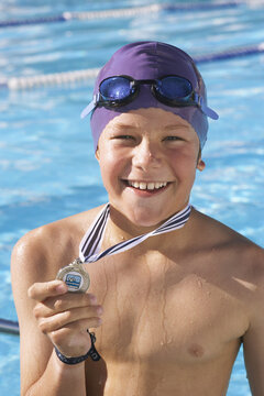 Boy Showing Medal