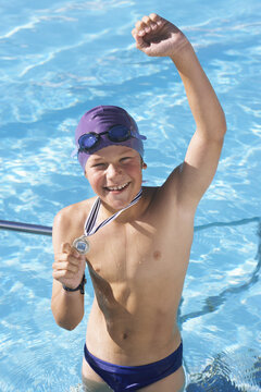 Boy Showing Medal