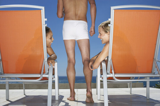 Women and Man At Poolside