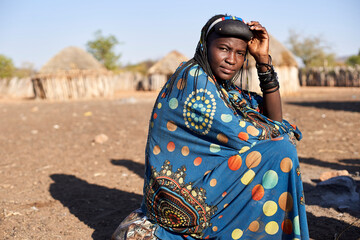 Portrait of a Muhacaona woman in her traditional colorful dress, Oncocua, Angola