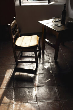 Chair, Bottle and Dominoes in Room