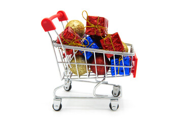 Boxes with gifts in supermarket grocery shopping cart isolated on white background. Copy space.