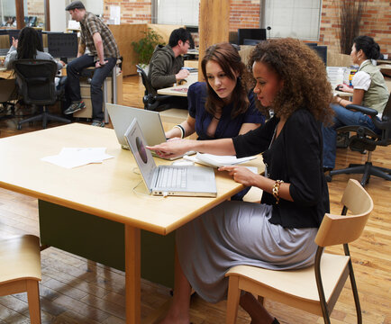 People Working in Small Office