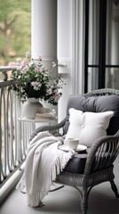 A wicker chair on a porch with a cup of coffee