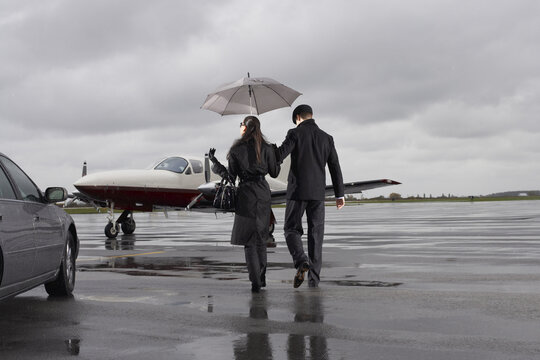 Man and Woman on Airport Tarmac