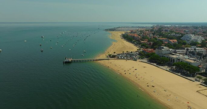 Aerial view Arcachon pier and the adjacent beach. Summer tourist spot, France