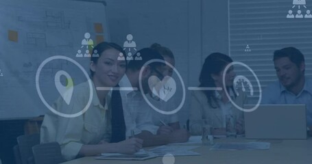 Animation of flowchart of icons over diverse coworkers discussing strategy in office - Powered by Adobe