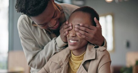 Love, happy and man surprise his girlfriend for romantic event, valentines day or anniversary. Smile, secret and young African couple bonding together for happiness and care in modern apartment.