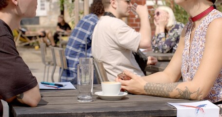 Gestures enhance spoken language, young people body details. Close-up hands during discourse time....