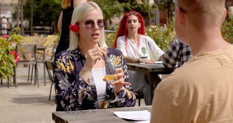 Chat informally, catch up with friends, or engage in light-hearted discussions. Social life People talking outdoor. Social gathering youth interact outdoors and work on building their relationships. 