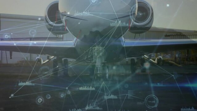 Animation of connected dots and graph over close up of parked airplane in airport