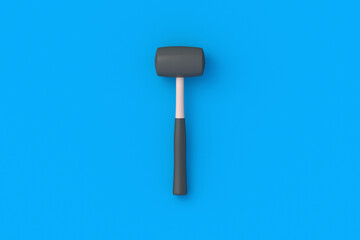 Rubber mallet on blue background. Home improvement. Repair tools. Construction activities. Industrial equipment. Top view. 3d render