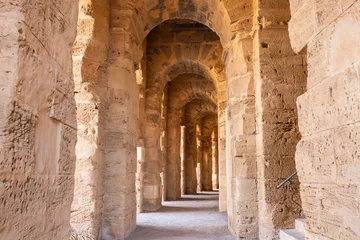 Fotobehang Interir of the amphitheater of the Roman ruins at El Jem. © emily_m_wilson