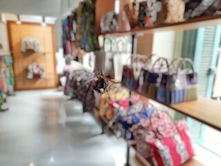 Naklejka na ściany i meble shopping in the mall, blurred background