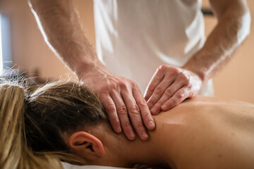 Fototapeta na wymiar unknown woman enjoy neck massage at beauty spa male therapist