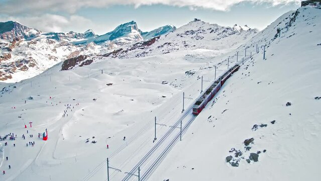 Cog railway train ride to the Gornergrat Observation Platform in Zermatt. Observation deck in Zermatt, Switzerland during snow in winter time.
