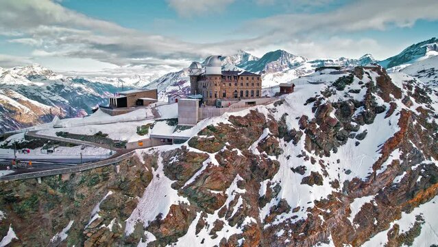 Aerial view of the Gornergrat Observation Platform on a rocky mountain covered with snow in Zermatt. Panoramic view from above the Observation deck in Zermatt, Switzerland during winter time.