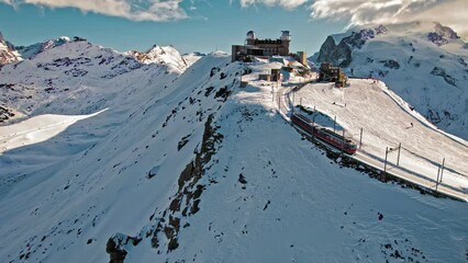 Cog railway train ride to the Gornergrat Observation Platform in Zermatt. Observation deck in Zermatt, Switzerland during snow in winter time.