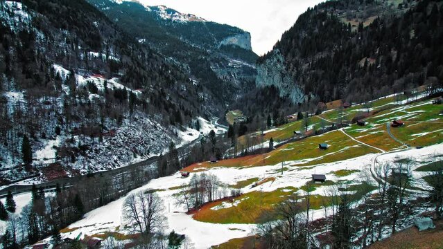 Scenic aerial view of Lauterbrunnen Valley to Staubbach Falls and Trummelbach Falls. View from above of rocky cliffs and Swiss Alps in Switzerland, Europe.