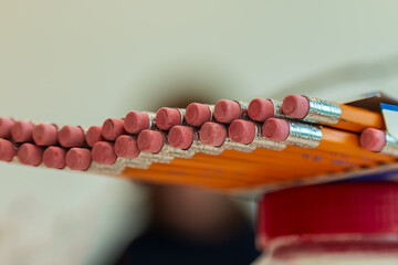 Pencils with erasers partially out of a box
