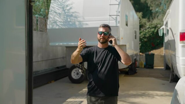 Man Giving Hand Signals Backing Trailer