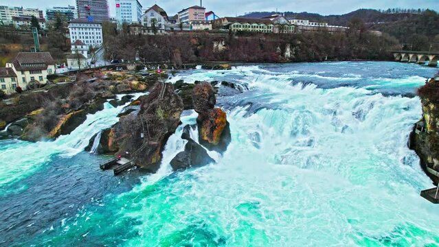 Aerial panoramic view of Rhine Falls, Rheinfall and railway Bridge in Switzerland. Switzerland View from above of the largest plain cascading waterfalls in Europe.