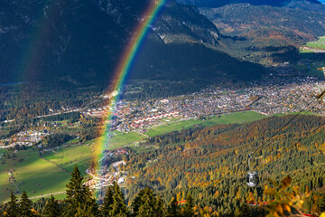 Aerial panorama of Garmisch-Partenkirchen with the rainbow, Bavaria, Germany - obrazy, fototapety, plakaty