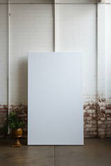 Photo of a small blank canvas leaning against a white wall. AI generative