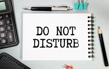 a white notebook with the text Do Not Resist Change Embrace It lies on a wooden surface