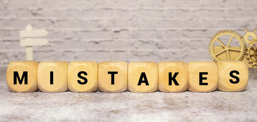 MISTAKES word written on wood block, business concept