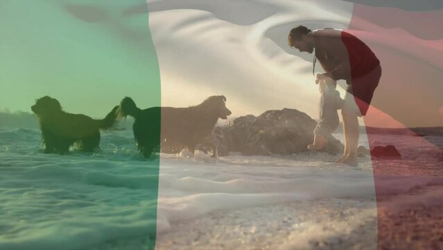 Animation of italian flag over caucasian father and child with dogs on sunny beach