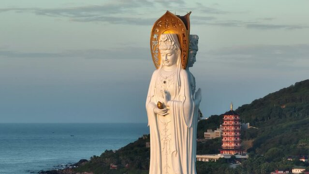Aerial footage of Guanyin statue at seaside in nanshan temple, hainan island , China