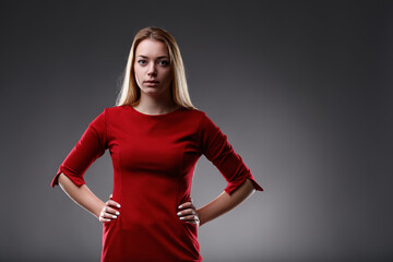 Red dress complements her commanding presence