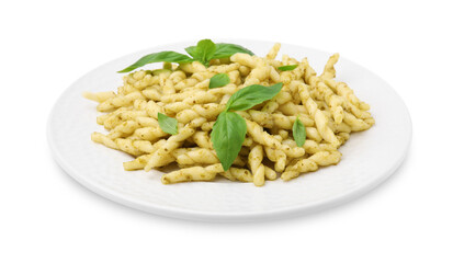 Plate of delicious trofie pasta with pesto sauce and basil leaves isolated on white