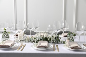 Beautiful table setting with floral decor indoors