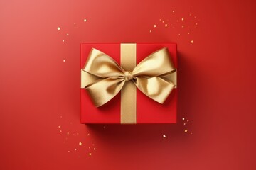 Luxurious Golden Bow on Red Gift Box, Top View