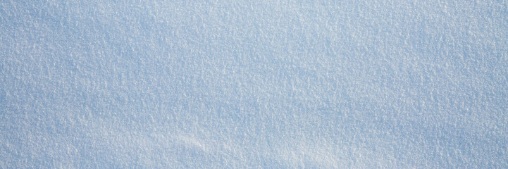 Natural snow texture. Smooth surface of clean fresh snow. Snowy ground. Winter background with snow...