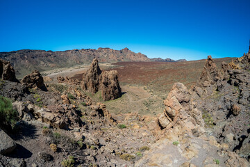 The lava fields of Las Canadas caldera of Teide volcano and rock formations - Roques de Garcia. Tenerife. Canary Islands. Spain.