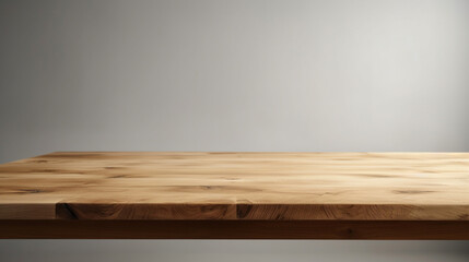 Empty wooden table on plain white background for product display.