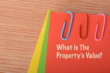 Red paper written with WHAT IS THE PROPERTY'S VALUE.