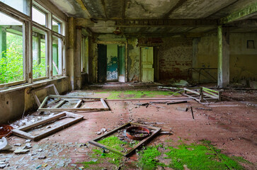 Hall of abandoned school in resettled village of Pogonnoe in exclusion zone of Chernobyl nuclear...