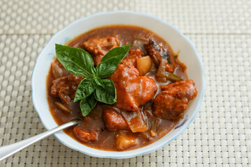 Chilly chicken with Kerala parathas porotta roti parotta barotta naan layered flatbread made from maida whole wheat flour. Eat with spicy Asian chicken beef egg curry gravy. Indian food.