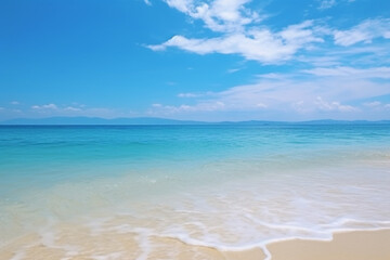 Beautiful sandy beach with calm ocean waves on a sunny day
