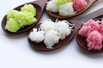 Sweet coconut balls, crispy coconut candies (Maprao Gaew). Thai traditional dessert