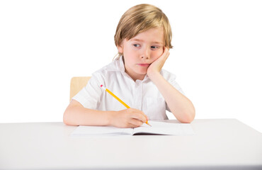 Digital png photo of caucasian schoolboy writing on transparent background